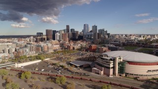 DX0001_001540 - 5.7K aerial stock footage flyby arena with the city skyline in the distance, Downtown Denver, Colorado