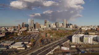 DX0001_001544 - 5.7K aerial stock footage of the city skyline seen while ascending by W Colfax Avenue, Downtown Denver, Colorado