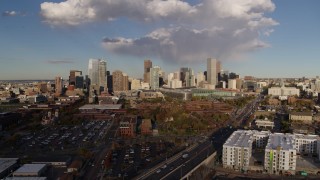 DX0001_001549 - 5.7K aerial stock footage of a reverse view of W Colfax Avenue and the city skyline, Downtown Denver, Colorado