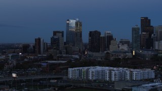 DX0001_001588 - 5.7K aerial stock footage of flyby skyscrapers and hotel high-rise at twilight, Downtown Denver, Colorado