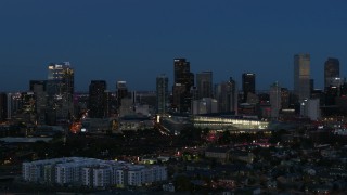 DX0001_001597 - 5.7K aerial stock footage passing the city's skyscrapers and convention center at twilight, Downtown Denver, Colorado