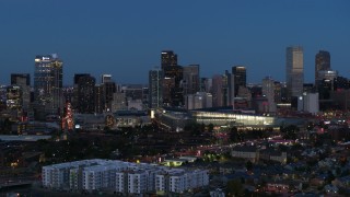 DX0001_001598 - 5.7K aerial stock footage passing the city's skyscrapers and convention center at twilight, Downtown Denver, Colorado