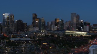 DX0001_001600 - 5.7K aerial stock footage descend and flyby the city's skyscrapers and convention center at twilight, Downtown Denver, Colorado