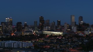 DX0001_001602 - 5.7K aerial stock footage of the convention center and city skyline at twilight, Downtown Denver, Colorado