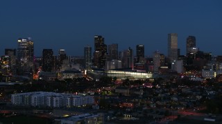 DX0001_001603 - 5.7K aerial stock footage of the convention center and city skyline at twilight, Downtown Denver, Colorado