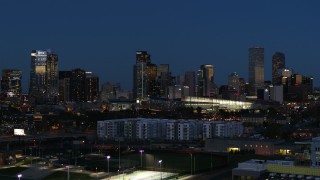 DX0001_001604 - 5.7K aerial stock footage of the convention center and city skyline at twilight during slow descent, Downtown Denver, Colorado