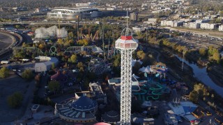 DX0001_001633 - 5.7K aerial stock footage flyby rides at Elitch Gardens at sunrise in Downtown Denver, Colorado