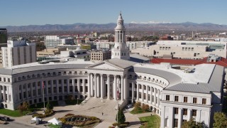 DX0001_001694 - 5.7K aerial stock footage of passing by the Denver City Council building, Downtown Denver, Colorado