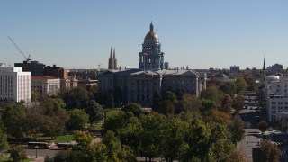 DX0001_001705 - 5.7K aerial stock footage of passing by the Colorado State Capitol during descent, Downtown Denver, Colorado