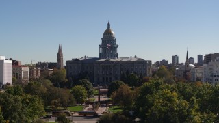 DX0001_001708 - 5.7K aerial stock footage flyby the Colorado State Capitol during ascent from park, Downtown Denver, Colorado