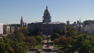 DX0001_001715 - 5.7K aerial stock footage reverse view of the Colorado State Capitol during descent to park, Downtown Denver, Colorado
