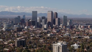 DX0001_001745 - 5.7K aerial stock footage of focusing on the city's skyline with mountains in distance, Downtown Denver, Colorado
