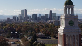 DX0001_001751 - 5.7K aerial stock footage of the city's skyline with Rockies in the background, pause for stationary view, Downtown Denver, Colorado