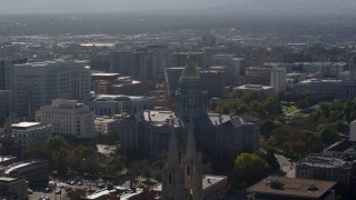 DX0001_001759 - 5.7K aerial stock footage of the Colorado State Capitol seen while ascending by cathedral, Downtown Denver, Colorado