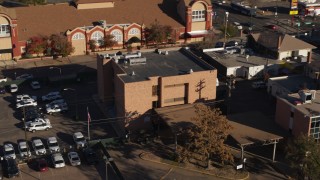 DX0001_001769 - 5.7K aerial stock footage orbit and fly away from a brick police station in Denver, Colorado