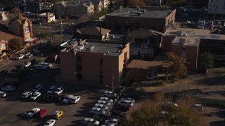 DX0001_001770 - 5.7K aerial stock footage flyby and approach a brick police station in Denver, Colorado