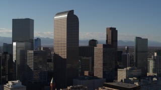 DX0001_001775 - 5.7K aerial stock footage of Wells Fargo Center and nearby skyscrapers in Downtown Denver, Colorado