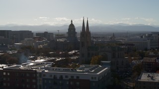 DX0001_001781 - 5.7K aerial stock footage of Colorado State Capitol, seen while passing the cathedral in Downtown Denver, Colorado