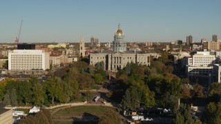 DX0001_001792 - 5.7K aerial stock footage focus on the Colorado State Capitol during short descent in Downtown Denver, Colorado