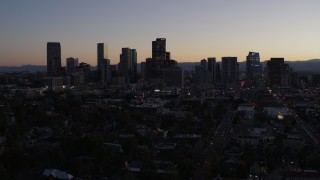 DX0001_001862 - 5.7K aerial stock footage of the city's skyline at twilight while flying away, Downtown Denver, Colorado