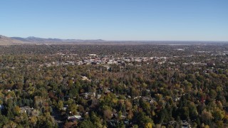DX0001_001890 - 5.7K aerial stock footage ascend for a view of Boulder, Colorado and surrounding neighborhoods
