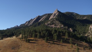 DX0001_001895 - 5.7K aerial stock footage of approaching the flatirons on the side of Green Mountain in the Rocky Mountains, Colorado