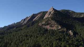 DX0001_001896 - 5.7K aerial stock footage of flying by the flatirons on the side of Green Mountain in the Rocky Mountains, Colorado