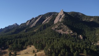 DX0001_001900 - 5.7K aerial stock footage of passing by Green Mountain's flatirons in the Rocky Mountains, Colorado