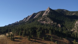 DX0001_001901 - 5.7K aerial stock footage of flying by Green Mountain's flatirons in the Rocky Mountains, Colorado