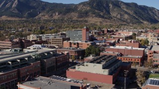 DX0001_001914 - 5.7K aerial stock footage fly over shops and office buildings to approach a taller office building in Boulder, Colorado