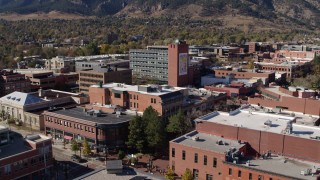 DX0001_001915 - 5.7K aerial stock footage focus on tall brick office building in Boulder, Colorado