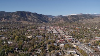 DX0001_001918 - 5.7K stock footage aerial video ascend to stationary view of Boulder, Colorado with mountains in background