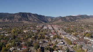 DX0001_001919 - 5.7K aerial stock footage descend with a view of Boulder, Colorado with mountains in background