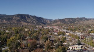 DX0001_001920 - 5.7K aerial stock footage ascend and flyby Boulder, Colorado with mountains in background