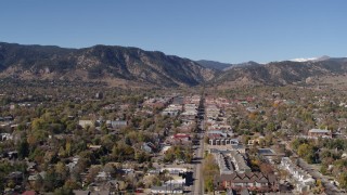 DX0001_001922 - 5.7K aerial stock footage ascend and flyby Boulder, Colorado with mountains in background