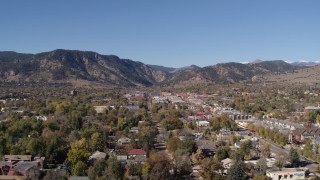 DX0001_001924 - 5.7K aerial stock footage ascend while flying by Boulder, Colorado with mountains in background