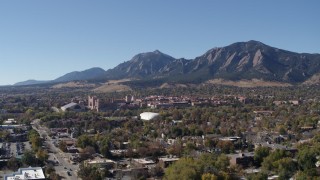 DX0001_001928 - 5.7K aerial stock footage ascend for view of the University of Colorado Boulder with Green Mountain in background