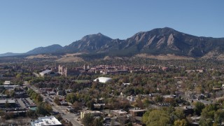 DX0001_001929 - 5.7K aerial stock footage of the University of Colorado Boulder and Green Mountain in distance