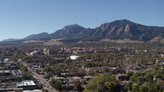 DX0001_001932 - 5.7K aerial stock footage pass the University of Colorado Boulder and Green Mountain in distance