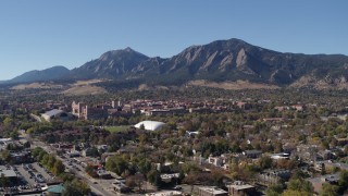 DX0001_001933 - 5.7K aerial stock footage approach the University of Colorado Boulder and Green Mountain in distance