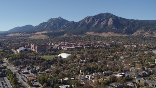 DX0001_001934 - 5.7K aerial stock footage of a reverse view of the University of Colorado Boulder, and Green Mountain in distance