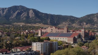 DX0001_001945 - 5.7K aerial stock footage ascend while passing campus buildings at the University of Colorado Boulder