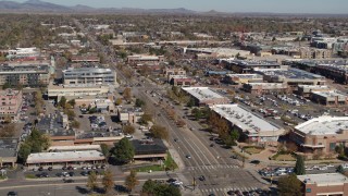 DX0001_001948 - 5.7K aerial stock footage of a strip mall beside a wide street in Boulder, Colorado