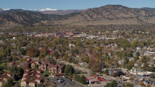 DX0001_001953 - 5.7K aerial stock footage of passing the mountain town of Boulder, Colorado