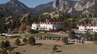 DX0001_001957 - 5.7K aerial stock footage of flying by the historic Stanley Hotel in Estes Park, Colorado while ascending