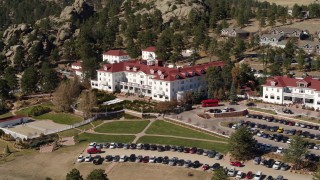 DX0001_001958 - 5.7K aerial stock footage of passing by the historic Stanley Hotel in Estes Park, Colorado