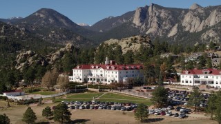 DX0001_001961 - 5.7K aerial stock footage of passing the historic Stanley Hotel in Estes Park, Colorado