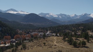 DX0001_001973 - 5.7K aerial stock footage of the Rocky Mountains and the mountain town of Estes Park, Colorado while descending