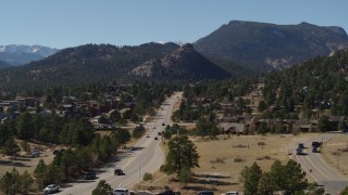DX0001_001974 - 5.7K aerial stock footage of a road through the town of Estes Park, Colorado near mountains