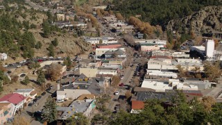 DX0001_001987 - 5.7K aerial stock footage of shops lining the road through Estes Park, Colorado seen during descent